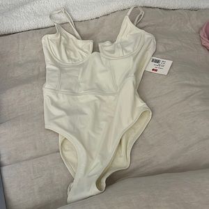 Solid and stripes one piece in cream. The Veronica. Size medium. Never worn.